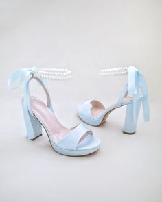 Satin platform block heel sandals with double pearls ankle strap for more elegance and romantic look. Classic inspired wear for your special day. Perfect for brides, bridesmaids, prom night, date night, and definitely a highlight on every special occasions.DETAILS:HEELS: 4 inchesUPPER: Synthetic upper and liningMATERIALS: Manmade outsoleORIGIN: Imported Light Blue High Heels, Blue Heels Wedding, Homecoming Heels, Baby Blue Heels, Light Blue Heels, High Heels For Prom, Homecoming Shoes, Pretty Sneakers, Blue High Heels