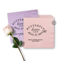 two pink and purple paper napkins with a single rose on top, one is for butterfly kisses and the other is for miss to miss