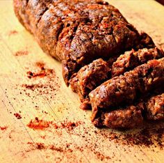 meatloaf on a wooden cutting board with spices