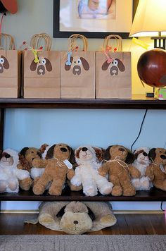 stuffed animals are lined up on a shelf in front of a baby's room