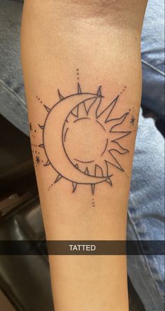 a tattoo on the leg of a person with sun and moon tattoos on their legs