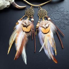 Natural feather earrings, dreamcatcher, long feather earrings, ethnic style, Native American, boho, bohemian, festival These earrings are made up of: golden metal dream catcher 3cm in diameter natural feathers of rooster, chinchilla rooster, silver pheasant, venerated pheasant brown suede tiger's eye, wood and glass beads Height (without hook): 16cm brass hooks gilded with 24K fine gold, cadmium-free, nickel-free and lead-free Delivered by tracked mail Brown Festival Earrings, Bohemian Feather Earrings For Festivals, Bohemian Dangle Feather Earrings, Bohemian Dangle Earrings With Feathers, Bohemian Brown Feather Jewelry, Festival Feather Dangle Jewelry, Silver Pheasant, Brass Hooks, Dream Catcher Earrings