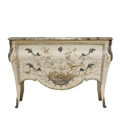 an ornate white and gold chest with birds on it