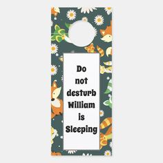 a door hanger that says, do not destruct william is sleeping on it