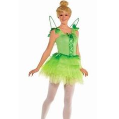 a woman in a green costume is posing for the camera with her hands on her hips