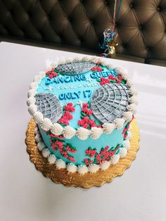 a decorated cake sitting on top of a table