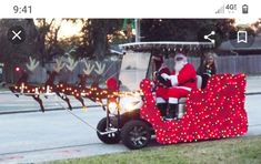 santa claus riding in a golf cart decorated with lights