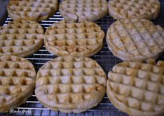 several waffles on a cooling rack ready to be cooked in the oven for consumption