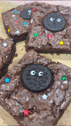 cookies and oreos are decorated on top of brownies with eyes, noses and stars