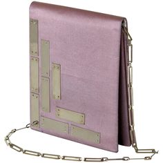 This Pierre Cardin evening bag has a space age sensibility, an iconic style of this designer. The use of the metal panels lends a futuristic, high tech feel to the simple, silk, flap top bag. It is satin lined and has a strap made of a flat link chain. This petite shoulder bag is prefect for an evening out where you will only need to take a few items with you. Please contact us if you have any questions. Designer Square Clutch For Evening, Designer Square Evening Clutch, Designer Square Evening Bag, Contemporary Rectangular Evening Shoulder Bag, Contemporary Rectangular Shoulder Bag For Formal Occasions, Modern Rectangular Shoulder Bag For Events, Contemporary Formal Rectangular Shoulder Bag, Vintage Futuristic, Vintage Evening Bags