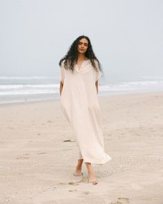 Indulge in effortless elegance with our Women's Gauze Caftan Maxi Dress. Crafted from airy and soft muslin gauze fabric, this dress exudes summer and unparalleled comfort. Embrace free-spirited style with its flowy silhouette and relaxed fit, perfect for lounging at the beach or strolling through summer markets. Elevate your wardrobe with this versatile piece, ideal for both casual outings and special occasions. Discover the epitome of laid-back luxury with our Gauze Caftan Maxi Dress. soymilk - Breezy Relaxed Fit Maxi Dress For Daywear, Breezy Maxi Dress For Loungewear, Breezy Maxi Length Dress For Loungewear, Flowy Breezy Maxi Dress For Loungewear, Breezy Flowy Maxi Dress For Loungewear, Breezy Relaxed Fit Maxi Dress, Breezy Flowy Loungewear Dress, Airy Flowy Dress For Beach Cover-up, Relaxed Linen Beach Dress