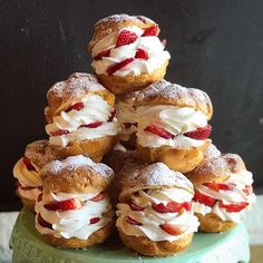 a stack of pastries sitting on top of a green plate