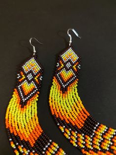 Unique, extra long earrings. Bright yellow orange color. Hypoallergenic clasp Length 6.5 inches (17cm) Width 1 inch (2.5 cm) If you want these earrings in a different color, write to me and I will gladly make them for you. Long Beaded Earrings, Native Earrings, Extra Long Earrings, Beaded Earrings Native, Orange Earrings, Earrings Dainty, White Earrings, Earrings Statement, Modern Earrings