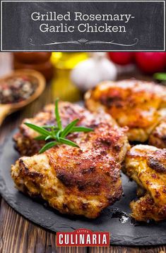 grilled rosemary garlic chicken on a black plate with text overlay that reads grilled rosemary garlic chicken