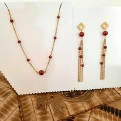 This jewelry set consists of a necklace (at the base of the neck) and earrings. The shades are very pleasant - burgundy and gold - with a discreet shine, which gives a touch of femininity. The set is very elegant and will definitely give your outfit an extra touch of sophistication. The set is offered in a beautiful gift box. I also invite you to choose other similar products from my store! Romantic Jewelry, Romantic Jewellery, Women's Jewelry Sets, Jewelry Christmas, Set Necklace, Burgundy And Gold, Necklace And Earrings, Trendy Jewelry, Beautiful Gift Boxes