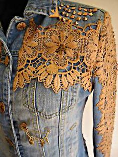 a denim jacket with lace and buttons on it