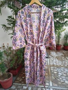 This Robe we makes from 100% Cotton printed fabric. The fabric print is Anokhi Floral which is very popular in all over the world . We use pure cotton cambric fabric . This is free One size robe . There is both side pocket in robe. Length = 120 cms. ( 48 inches) Printed Pink Sleepwear For Home, Pink Printed Sleepwear For Home, Multicolor Cotton Robe With Floral Print, Pink Floral Print Home Robe, Pink Cotton Sleep Robe, Floral Print Fitted Cotton Sleepwear, Pink Floral Print Robe For Home, Beach Cotton Nightgown With Floral Print, Fitted Pink Printed Sleepwear