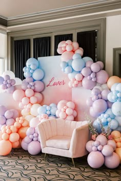 a room with balloons and chairs in it