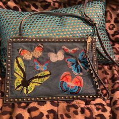 New Urban Expressions Butterfly Embroidered Denim Studded Clutch With Blue Vegan Leather Back. 3 Ways To Wear; Wrist Strap (Removable) Crossbody Strap (Removable Or As Envelop Clutch. Zipper Closure. 3 Pockets Inside, One With Zipper. 13w By 9w So Large Size Fits A Lot! Condition Is Excellent, New Without Tags. Certified Vegan And Beautiful Embroidery. Perfect Accent Denim Piece. Hard To Find/Unique. Blue Embroidered Denim Bags, Casual Embroidered Denim Bag, 3 Ways To Wear, Studded Clutch, Envelope Clutch, Embroidered Denim, Beautiful Embroidery, Wrist Strap, Crossbody Strap