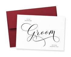 a card with the word groom written on it in cursive writing and red envelope