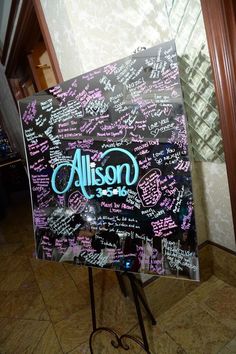 a sign that has writing on it in front of a mirror with the word allson written on it