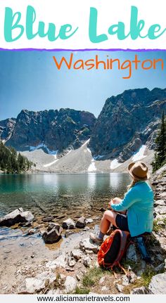 a woman sitting on top of a rock next to a lake