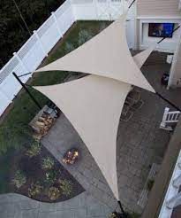 an overhead view of a patio with tables and umbrellas in the middle of it