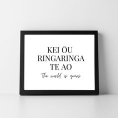 a framed black and white poster with the words kel ou ringringa tea ao