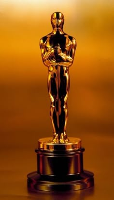 an oscar statue sitting on top of a table