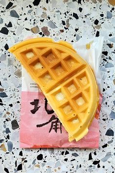 a waffle sitting on top of a piece of paper