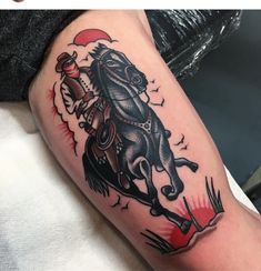 a man with a horse tattoo on his arm