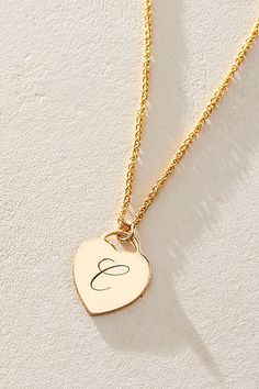 Just as effortless as it is elegant, this stunning necklace features a heart-shaped pendant with gorgeous cursive engraved initial for the ideal finishing touch. * 14k Gold Filled wheat chain * Personalized, laser engraved, 14k Gold Filled 12x14mm heart charm * Length: 18" * 5 days of production | Set & Stones Personalized Alice Necklace at Free People in Gold Elegant Silver Initial Necklace For Anniversary, Elegant Double Heart Name Necklace For Anniversary, Elegant Initial Necklace With Charms As Gift, Elegant Personalized Charm Necklace As A Gift, Elegant Sterling Silver Initial Necklace With Charms, Elegant Double Heart Name Necklace For Mother's Day, Elegant Personalized Gift Charm Necklace, Elegant Nameplate Initial Necklace For Anniversary, Elegant Heart Charm Pendant Necklace