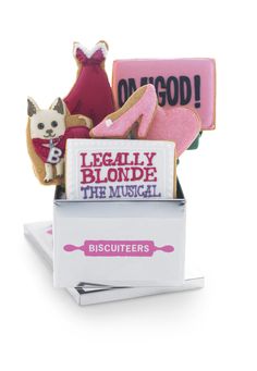 some cookies are stacked on top of each other with the words legally blonde in pink