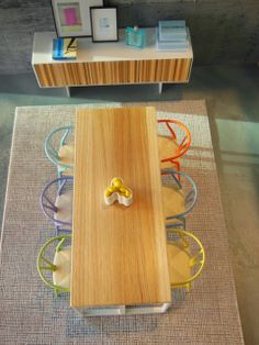 an overhead view of a dining room table and chairs