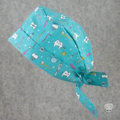 a blue bandana with various items all over it and tied up to the side