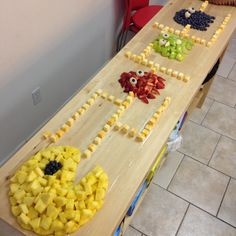 the table is made to look like fruit with faces on it and eyes drawn on them