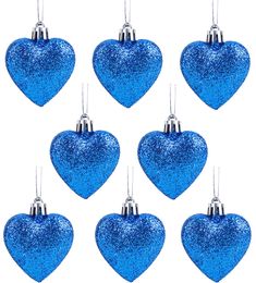 six blue glitter heart ornaments hanging from strings