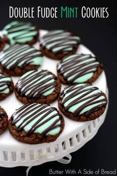 chocolate and mint cookies on a white platter with the words double fudge mint cookies