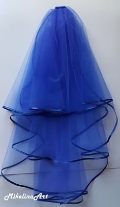 three tiered blue tulle skirt hanging on the wall