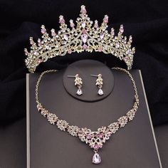 a tiara and earrings are on display