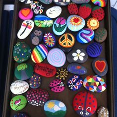 a tray filled with lots of different colored rocks