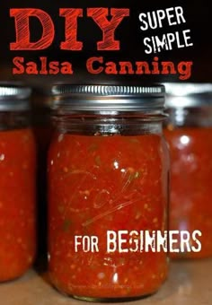 three mason jars filled with salsa sitting on top of a wooden table next to the words diy super simple salsa canning for beginners