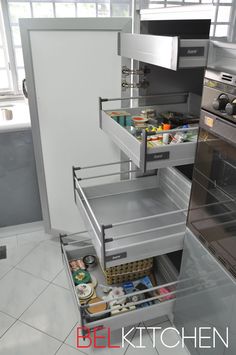 an open refrigerator in a kitchen next to a stove