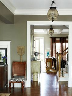 an image of a living room with furniture and decor on the walls, along with other items