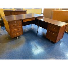 two wooden desks sitting on top of each other