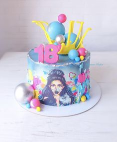 a decorated birthday cake with an image of a woman on the side and balloons all around it