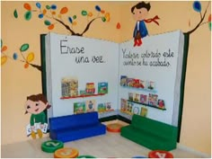 a child's playroom with books and toys on the floor in front of it