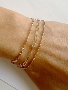 Introducing our Everyday Delicate Set of 3 bracelets! Crafted with a blend of delicacy and durability, these bracelets feature dainty chains perfect for layering with our other bracelets. They exude simplicity and chicness! These bracelets are perfect for gifting, whether it's for moms, grandmas, sisters, brides-to-be, bridesmaids, flower girls, baby showers, graduations, birthdays, bachelorette parties, best friends, teachers... the possibilities are endless! 🌟 Each listing is for one set of 3 bracelet. ► Enjoy discounts starting from 3 items. Contact us for more details. One discount per purchase. HOW TO ORDER:  ▸ Simply add to cart and include any special instructions in the 'notes' box at checkout. D E T A I L S : ● Gold/Rose Gold/Silver Plated ● Sizes:   - Dot chain bracelet: 6" chai Stackable Rose Gold Bangle Chain Bracelet, Stackable Rose Gold Bangle Bracelet, Rose Gold Stackable Bangle Chain Bracelet, Everyday Rose Gold Jubilee Bracelet, Rose Gold Bangle Charm Bracelet For Everyday, Everyday Rose Gold Bangle Charm Bracelet, Dainty Rose Gold Stackable Bracelets, Rose Gold Beaded Jubilee Bracelet For Everyday, Rose Gold Jubilee Beaded Bracelets For Everyday