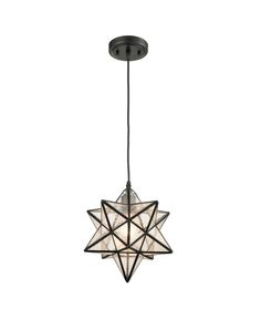 a light hanging from the ceiling with a star design on it's center piece