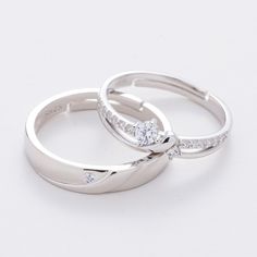 two white gold wedding rings with diamonds